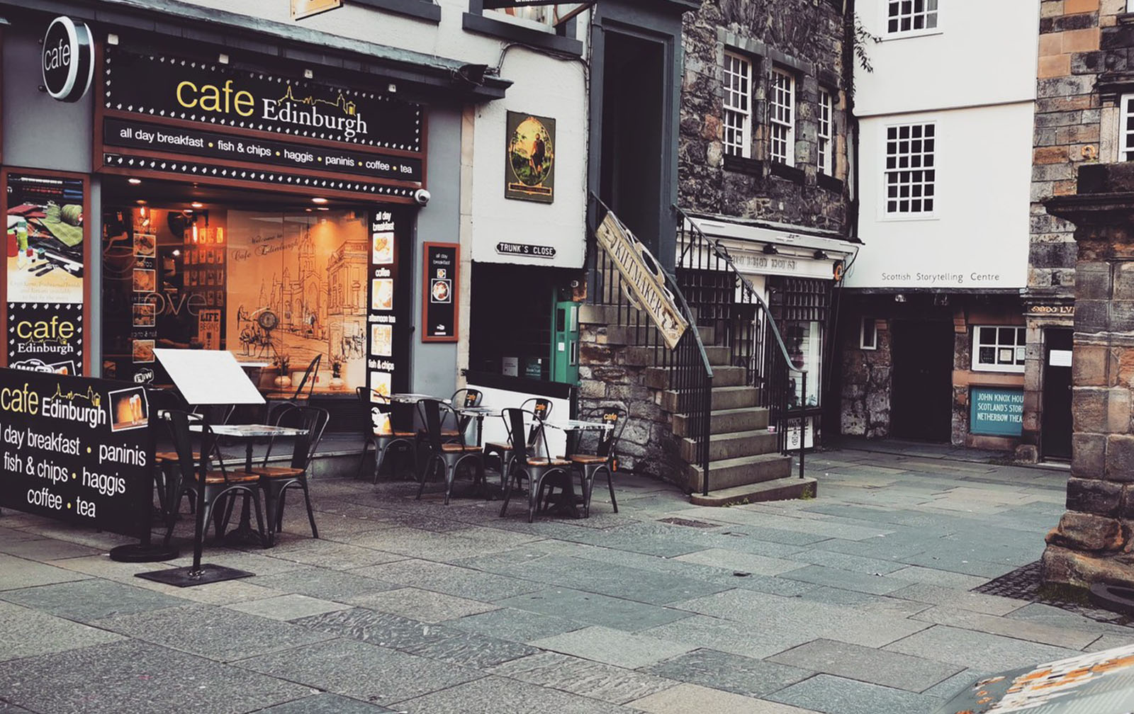 Amber-lit dining room beneath Old Town stone arches